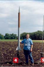 Doug Gardei stands next to his Ladyrobin before its flight with a Skidmark motor.