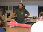 Robert shows how the supersonic jetstream peeled back the carbon fiber on his fins.